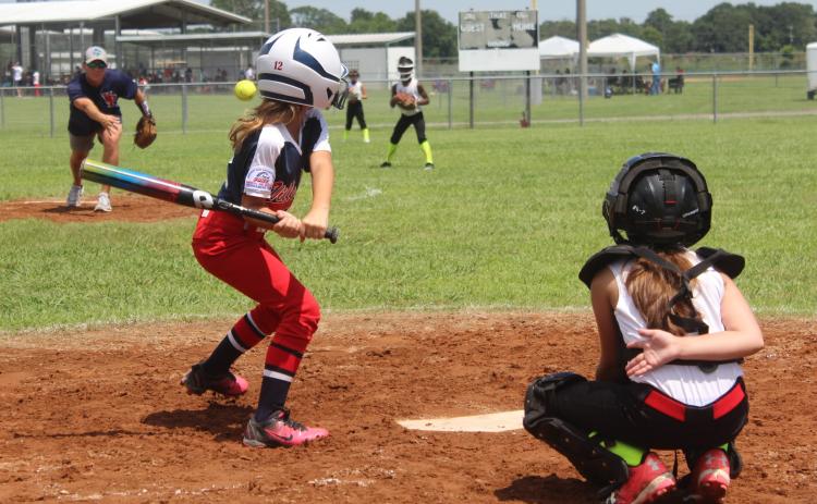 Alyssa Quibodeaux awaits a pitch in a game in the PONY Regionals Tournament played in Eunice. Quibodeaux’s 8U team from Ville Platte claimed the title and will now play in the World Series in Youngsville. (Gazette photo by Rhett Manuel)