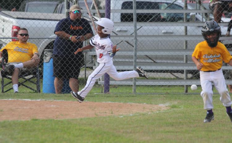 Amari Carr (9) trots around the bases and approaches home plate after hitting a home run in Ville Platte East’s 21-5 win over Oakdale to begin the East Sub-District Tournament. Carr and the rest of the T-Ball All-Stars from Ville Platte will now compete in the Dixie Youth District 7 Tournament here in Ville Platte beginning Thursday, June 23. (Gazette photo by Tony Marks)