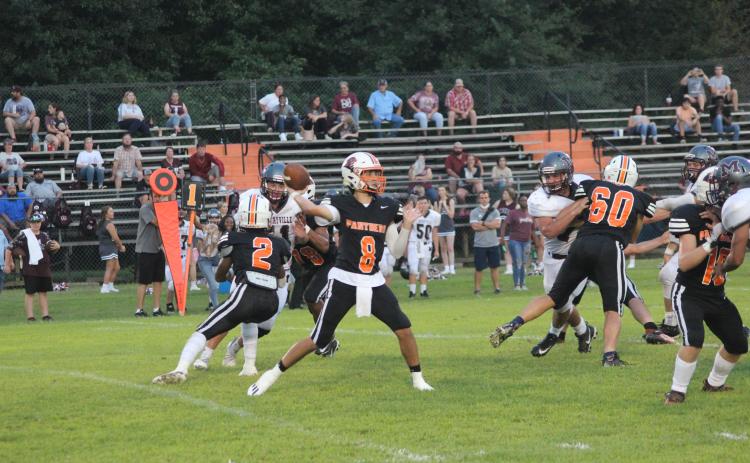 Branson Fontenot (8) delivers a pass in Pine Prairie’s 49-16 win over Merryville earlier this season. The Panther quarterback went 12 for 15 with 312 yards and five touchdowns in the team’s first win in two seasons and went on to be named as a member of the All-District first team. (Gazette photo by Rhett Manuel)