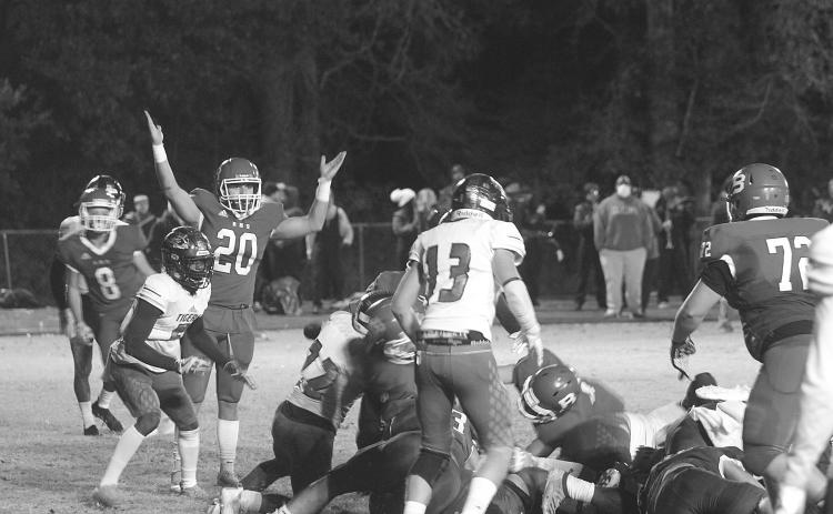 Basile’s Justin Smith (20) celebrates as Ethan Bazinet crosses the goal line for a touchdown in the Bearcats’ season ending loss to Logansport in the quarterfinals. (Gazette photo by Tony Marks)