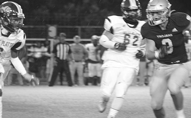 Briggs Ardoin (3) runs toward a Ville Platte High rusher as he looks to make a tackle for Sacred Heart in the Tee Cotton Bowl. Ardoin and the rest of the Trojans now take their show on the road for the second consecutive week. (Gazette photo by Rhett Manuel)