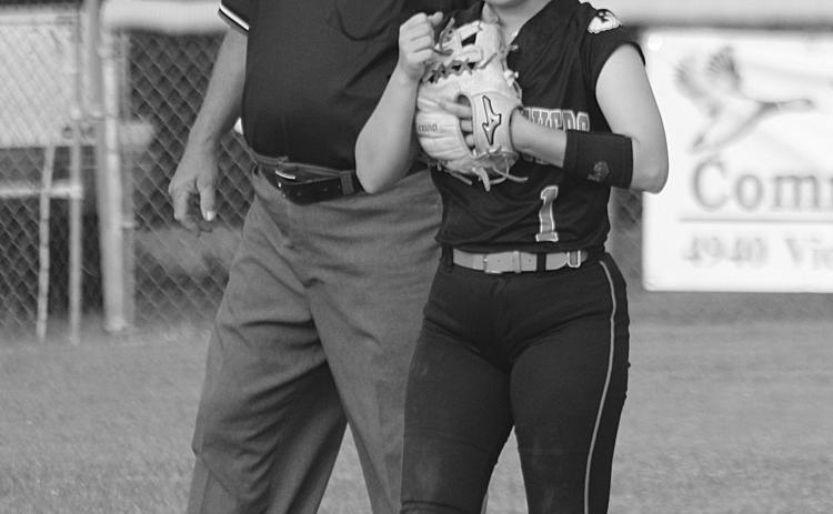 Victoria Briscoe (1) gives a fist bump to a Pine Prairie teammate after making a play at shortstop. (Gazette photo by Rhett Manuel)