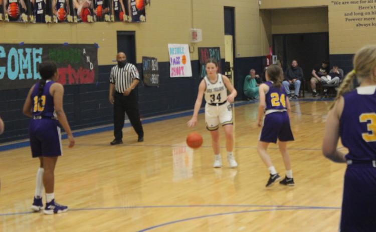 Taylor Darbonne (34) takes the basketball down the court in Sacred Heart’s home win against Opelousas Catholic. (Gazette photo by Rhett Manuel)