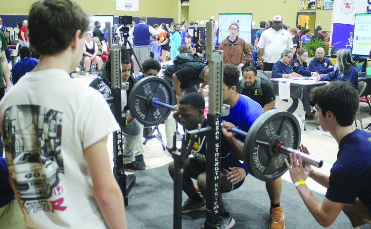 Kendarius Doucet, of Ville Platte, is pictured as he attempts a squat during the invitational held Saturday, January 10. He competed in the 165 weight class with a total of 720 pounds. (Gazette photo by Tony Marks)