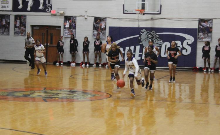 Vandryua Wilson (22) drives down the court for the Ville Platte High Lady Bulldogs in their playoff loss to Baker, 58-53, at home Thursday night. (Gazette photo by Rhett Manuel)