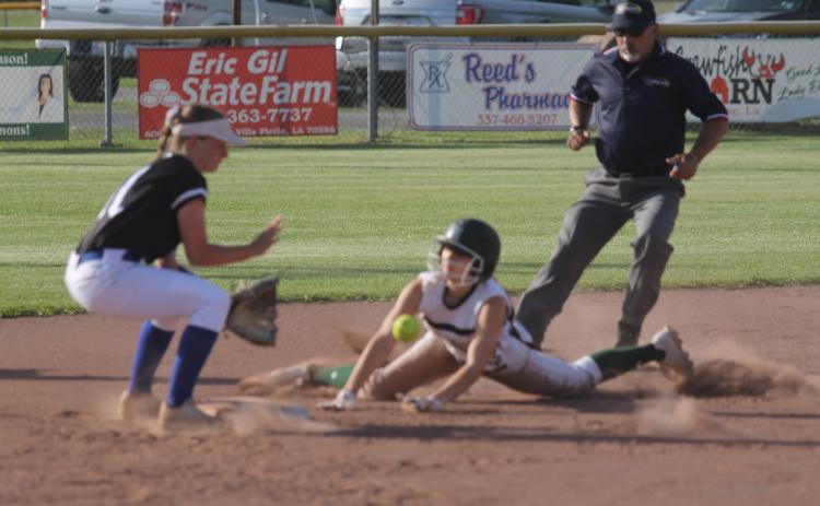 Kylie Rider (22) slides safely into the second base bag after leading off the game with a single. She later scored Mamou’s first run of the Lady Green Demons’ 8-3 win over Erath in the Class 3A playoffs. The team now plays Buckeye today at 6 p.m. (Gazette photo by Tony Marks)