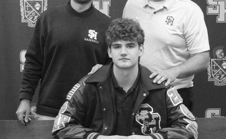 Pictured from left (standing) are Sacred Heart assistant coach Kayne Hargrave and head coach Gary Ashworth and (seated) Jackson Bruney. (Gazette photo by Tony Marks)