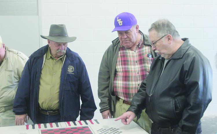 From left are Ville Platte Rotarians Bob Manuel, Steve Phillips, and Dan Poret as they inspect a game table in one of the cell blocks located inside the new Evangeline Parish jail. The new jail is nearing completion and is located inside the Industrial Park. (Gazette photo by Tony Marks)