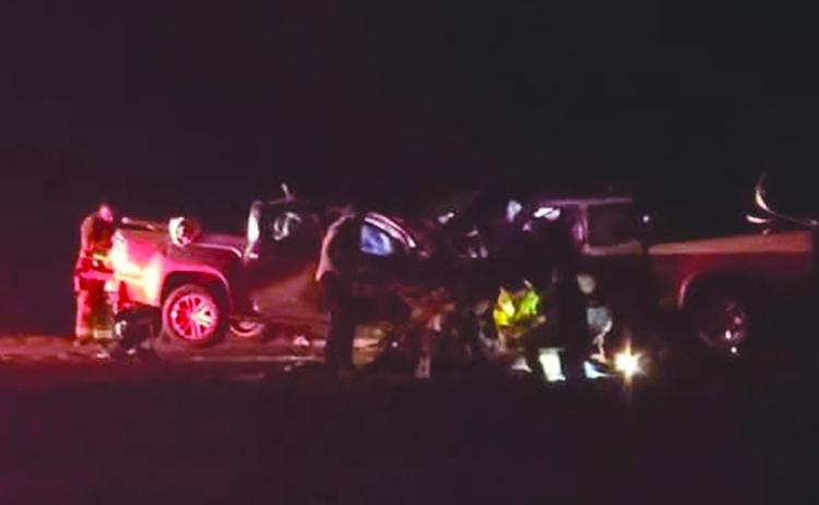 NEW YEAR’S ACCIDENT - Only flashlights and headlights show the results of  the January 1  head-on collision on Highway 190 just east of the Basile town limits.