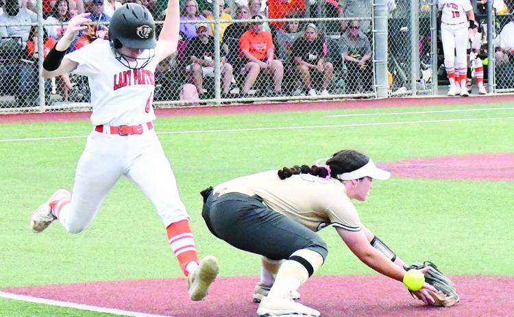 Macy (M.J.) Chauvin (8) legs out a single in Pine Prairie’s 3-2 loss to Jena in the softball state semifinal game. She had two of her team’s four hits. (Photo by Craig Franklin)