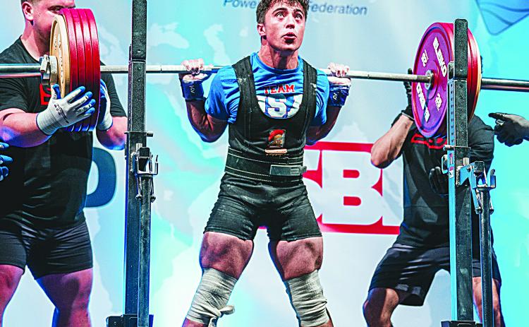 Liam Kincanon, a junior student at Sacred Heart, is pictured as he competes at the IPF/NAPF North American Regional Championships in St. John’s Newfoundland and Labrador, Canada, where he won four gold medals and set a record in squats. (Photo courtesy of Kayla Kincanon)
