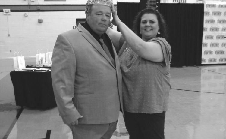 Jude Burton Jr. is crowned La. Swine Festival King by Melissa Clavier, festival association president, during the recent pageant.