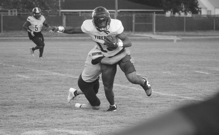 David Fontenot (11) makes a tackle on a Lafayette Renaissance Charter Academy player in a game on  Thursday night. (Gazette photo by Tony Marks)