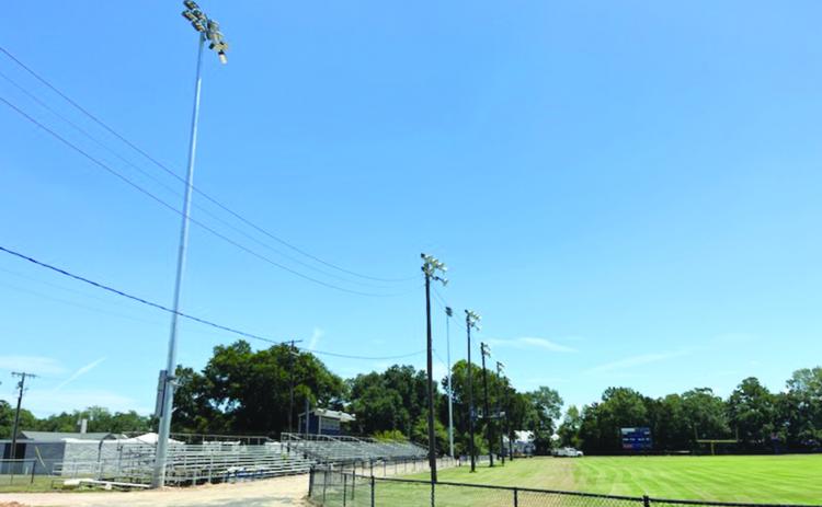 Pictured in the left and right photos are the newly installed lights at Soileau-Landry Field during the day and the night. (Photos courtesy of Kimberly Lejeune)