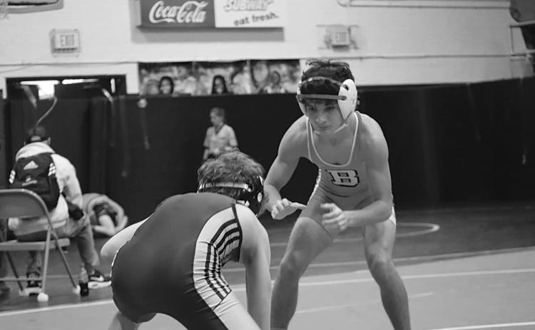 Logan Bergeron, State Champ at 106 lbs., is shown in action.