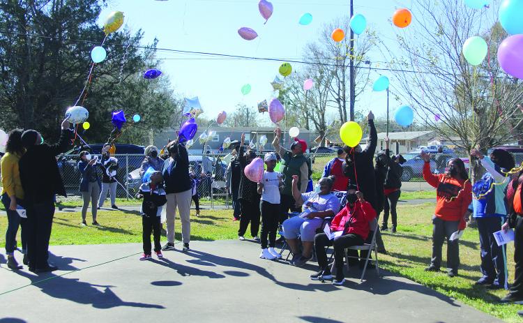 A balloon release takes place during the annual Martin Luther King Jr. Memorial Celebration held Monday, January 17, in Ville Platte. Among those pictured are Ville Platte Mayor Jennifer Vidrine, Assistant District Attorney Betsy Jackson and her mother, Beatrice, and Brian and Katrina Ardoin . (Gazette photo by Tony Marks)