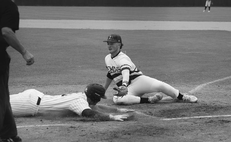 Trojan baserunner Briggs Ardoin (6) slides into home plate ahead of the tag from Mamou pitcher Wyatt Johnson (8). (Gazette photo by Rhett Manuel)