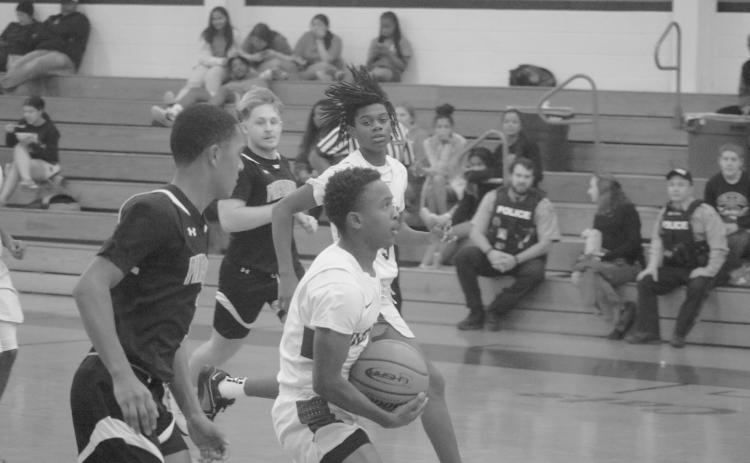 Kagien Richard (1) looks for a basket against Pine Prairie in the first game of this year’s parish tournament in Basile. (Gazette photo by Tony Marks)