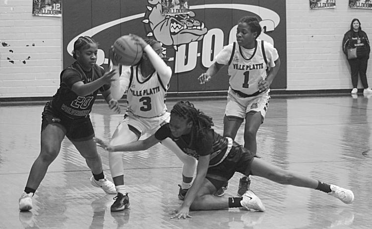 Yazminn Ardoin (3) tries to maintain possession of the basketball in the Ville Platte Lady Bulldogs’ playoff loss to the Mansfield Lady Wolverines on Monday night. (Gazette photo by Sylis Manuel)