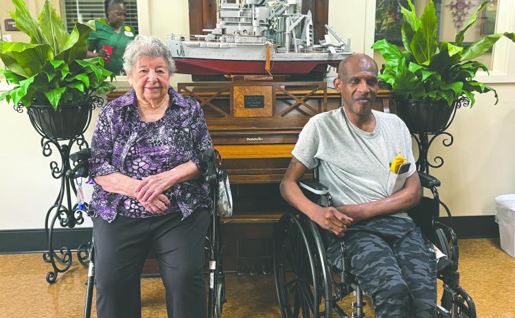 LA REINE ET LE ROI ENJOYED REIGN - Heritage Manor’s king and queen of the Cotton Festival, Le Roi Clanis Freeman (right) and La Reine Mary Sylvia Veillon (left) shared their enjoyment of their reigns. (Gazette photo by Heather Bogard)