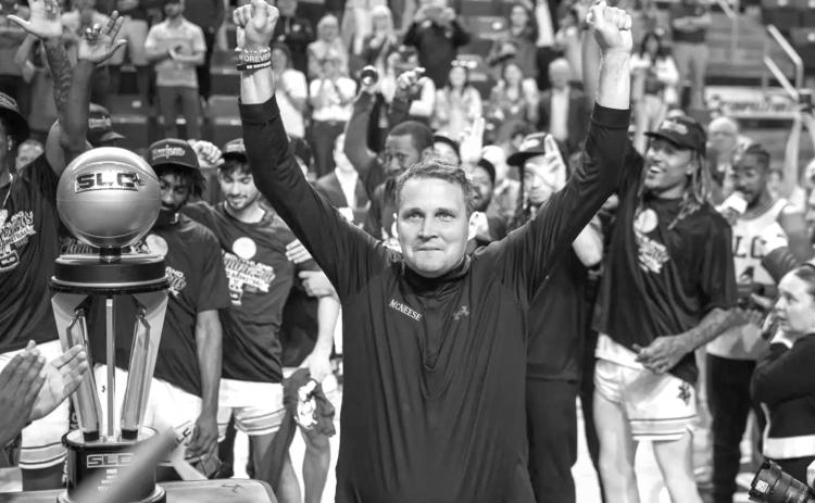 CELEBRATION TIME – McNeese men’s basketball coach Will Wade celebrates after the Cowboys repeated as Southland Conference Tournament champions. McNeese will play Clemson in the first round of the NCAA Tournament. (Photo by McNeese Athletics)