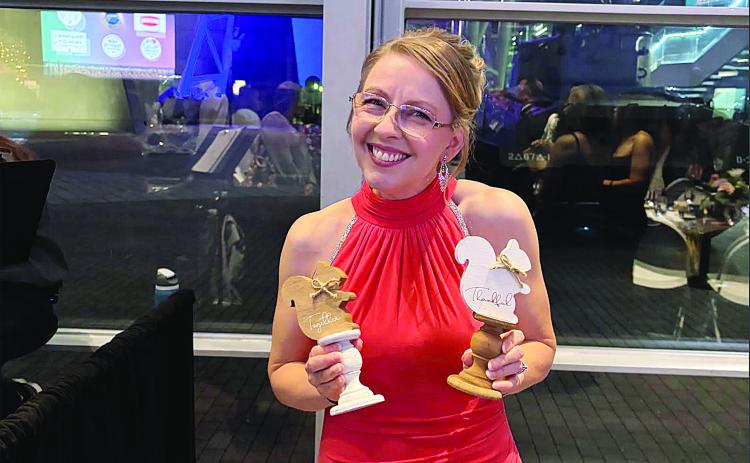 Melanie Soileau, of James Stephens Montessori, is pictured with some of her gifts at the awards gala in New Orleans. (Photo courtesy of Grace Sibley)
