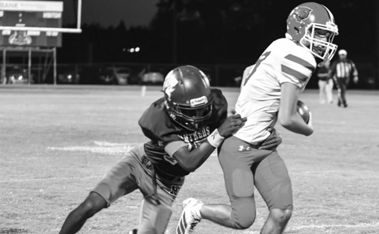 Landon Fontenot gets away from a Merryville defender. (Photo by Tonya Ortego)
