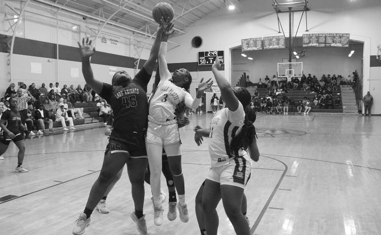 Yazminn Ardoin (3) goes up for a loose basketball in Ville Platte’s win over North Webster in the first round of the Non-Select Division III  playoffs. (Photo courtesy of Nick Jagneaux)