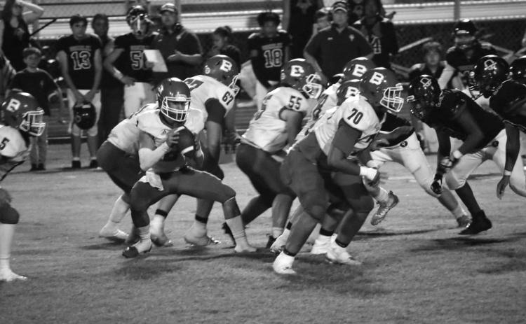 The Basile Bearcat offensive line stands tall against Oberlin while Jackson Courville makes his move at quarterback. (Photo by Rachel Manuel)