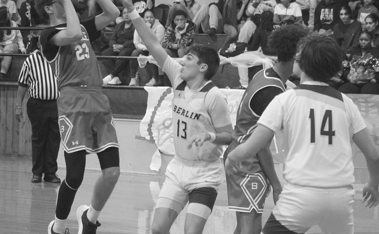 Wes Matt (23) gets off a basket for Basile as he is being guarded by Oberlin’s Kole Sonnier (13). (Gazette photo by Tony Marks)