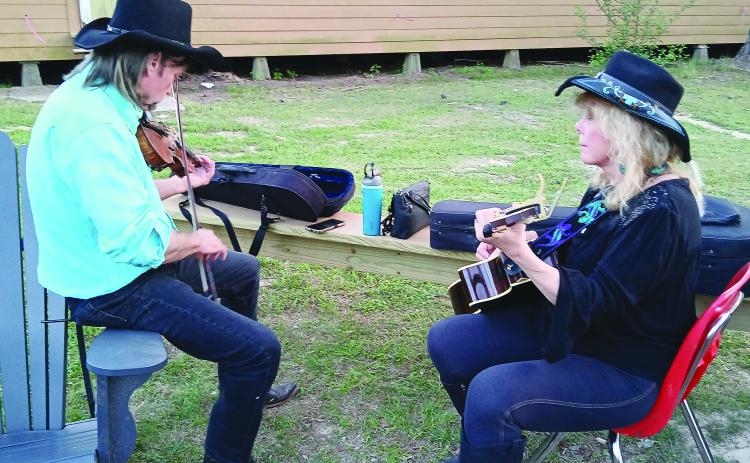 Pat and Cindy Onire, of Mississippi, are pictured playing their instruments during the Balfa Week celebration. The week was not only about music but also featured crafts, food, workshops and more. (LSN photo by Bobby Ardoin)