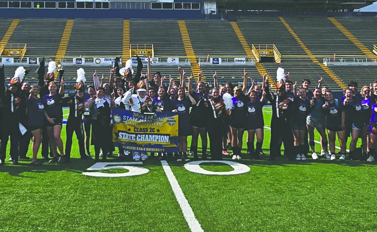 The Pine Prairie Marching Band celebrates being named the State Class 2C champions at the State LMEA marching competition held at McNeese State University in Lake Charles on Tuesday, November 5. (Photos courtesy of Pine Prairie Band Boosters)