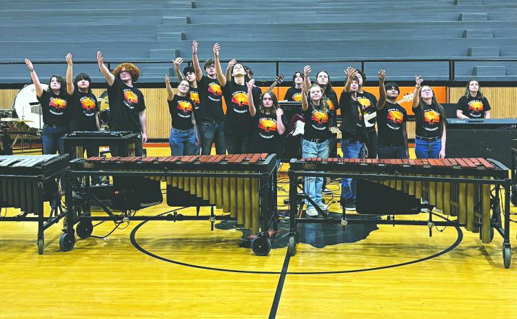 PPHS PERCUSSION ENSEMBLE SHOWS OFF TALENT - The PPHS Percussion Ensemble raises their hands at the close of their performance of their show “Steps to the Horizon.” (Gazette photo by Heather Bogard)