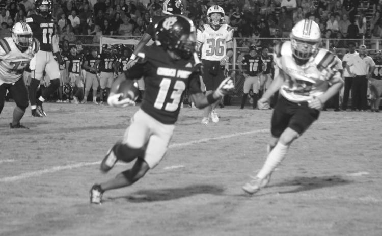Pine Prairie’s Keadon Blood (12) tries to keep pace with Church Point’s Jarrison Reese (13). (Gazette photo by Tony Marks)