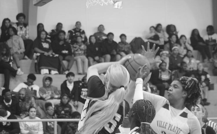Ville Platte’s Toni Falkenberry (35) attempts to block a shot from Pine Prairie’s Jolie West (15)