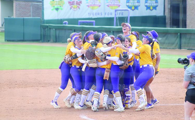 Members of the LSU softball team celebrate inside the pitching circle after the final out was recorded in Sunday’s run-rule win against Southern Illinois. (LSN photo by Tony Marks)
