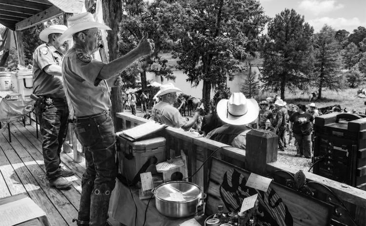 Colonel Ricky Duhon of Basile, a member of the Evangeline Parish Sheriff’s Posse serves as auctioneer at the annual St. Jude Trail Ride.
