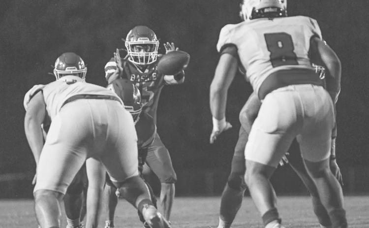 Basile’s Ricky Malone (15) gets the ball in the Wildcat quarterback position during last week’s Homecoming game. (Photo by Tonya Ortego)
