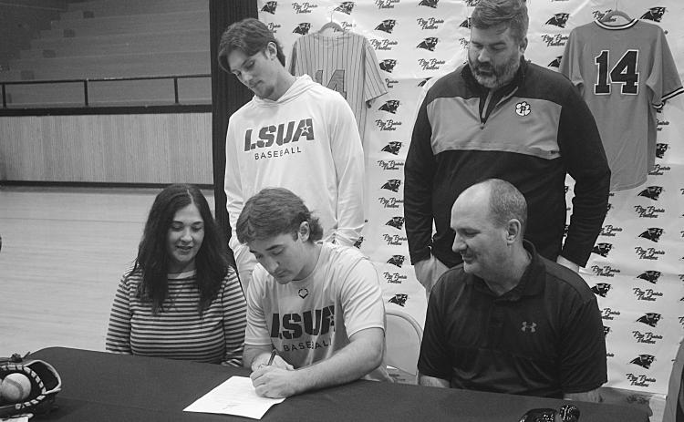 Riley Fontenot (seated in the center) is pictured as he signs with LSUA. Also pictured are: seated (from left) Shelly Fontenot and Ted Fontenot; standing (from left) Cayden McCollough and Dylan Manuel. (Gazette photo by Tony Marks