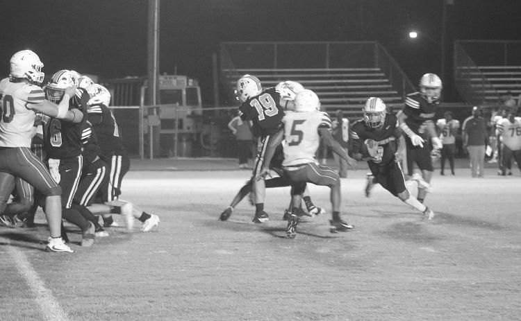 Kameren Guillory (9) finds a running lane for Pine Prairie in a 48-0 loss to Ringgold last week. (Gazette photo by Tony Marks)