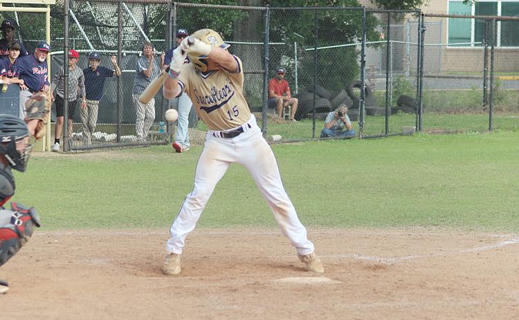 Sacred Heart catcher and two-hole hitter Blake Hebert (15) backs away from the plate as a pitch sails inside in the Trojans’ home playoff loss to Riverside Academy. (Gazette photo by Rhett Manuel)