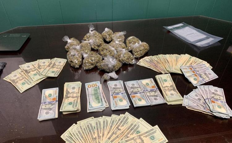 Pictured are marijuana, baggies, and U.S. currency seized during an execution of a search warrant performed by a joint operation among the Evangeline Parish Sheriff’s Office Narcotics Unit and Patrol Unit and the Louisiana Department of Probation and Parole. (Photo courtesy of EPSO)