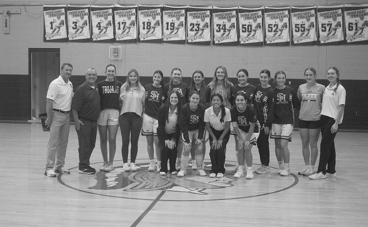 Last year’s Sacred Heart girls’ basketball team was honored prior to a scrimmage on Thursday, November 7. Pictured in no particular order are head coach Shane Darbonne, former head coach Craig Whittington, Bre Ardoin, Laura Prudhomme, Averie Pitre, Josie Vidrine, Mary Perron, Alyssa Brignac, Caroline Richardson, Jolie Vidrine, Rose Ardoin, Taylor Darbonne, Jodie Landry, Ava Johnson, Olivia Tate, Emily Ardoin, and Katherine Fontenot. Not pictured is Kali Shiver. Gazette photo by Tony Marks