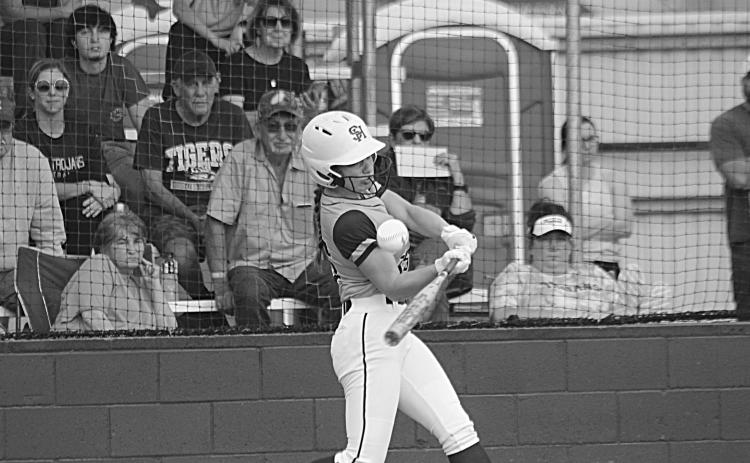 Lady Trojan Ava Johnson connects with a pitch in a game against Sam Houston at home. (Gazette photo by Rhett Manuel)