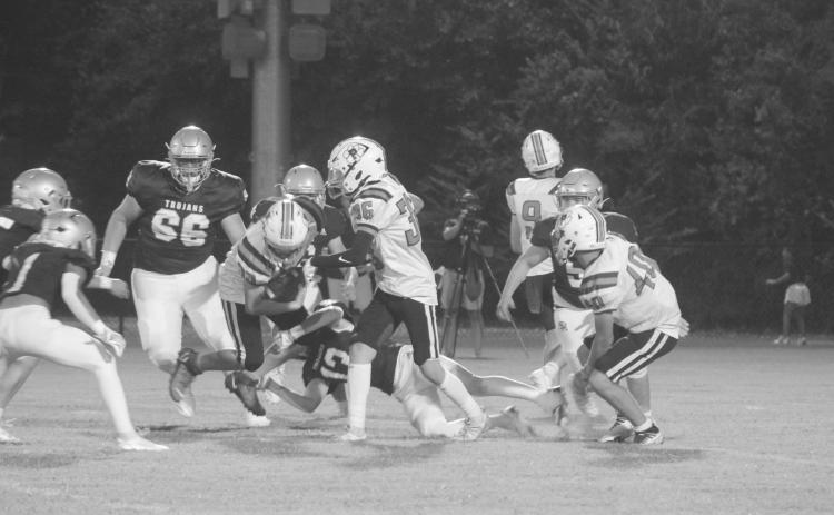 Sacred Heart’s Sully Manuel (13) makes a diving tackle on Pine Prairie’s Rhett Guillory (33) in the Trojans’ 42-0 win over the Panthers. (Gazette photo by Tony Marks)