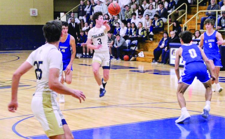 Ellis Chapman (3) passes the ball to a Trojan teammate in Sacred Heart’s 59-34 win over St. Edmund last Friday night. (LSN photo by Rhett Manuel)