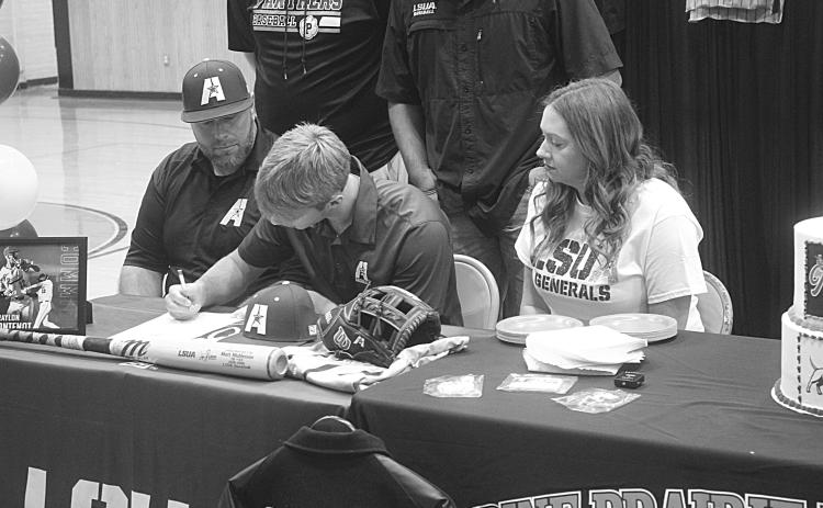 Braylon Fontenot (center), of Pine Prairie High School, is pictured as he signs to play baseball at LSUA. Pictured on the left is his father, Taylor, and on the right is his mother, Kelly. (Gazette photo by Tony Marks)