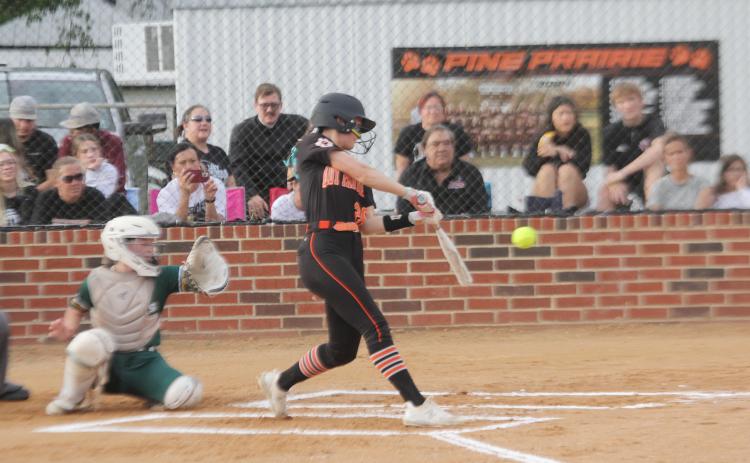 Sydney Fontenot (20) connects with a pitch in a Pine Prairie Lady Panther game against Mamou. (Gazette photo by Rhett Manuel)
