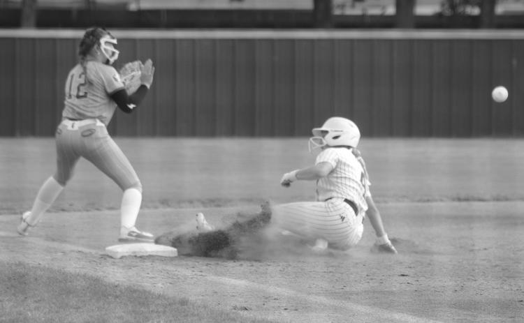 Ellie Wilmouth (4) slides in safely to third base ahead of the throw from a St. Frederick fielder in Sacred Heart’s 10-8 quarterfinal loss last Friday. (Gazette photo by Tony Marks)