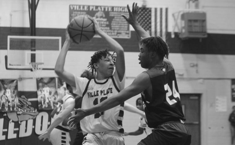 Jaden Jacobs looks to pass the basketball in Ville Platte High’s playoff loss to Sterlington. (Gazette photo by Rhett Manuel)